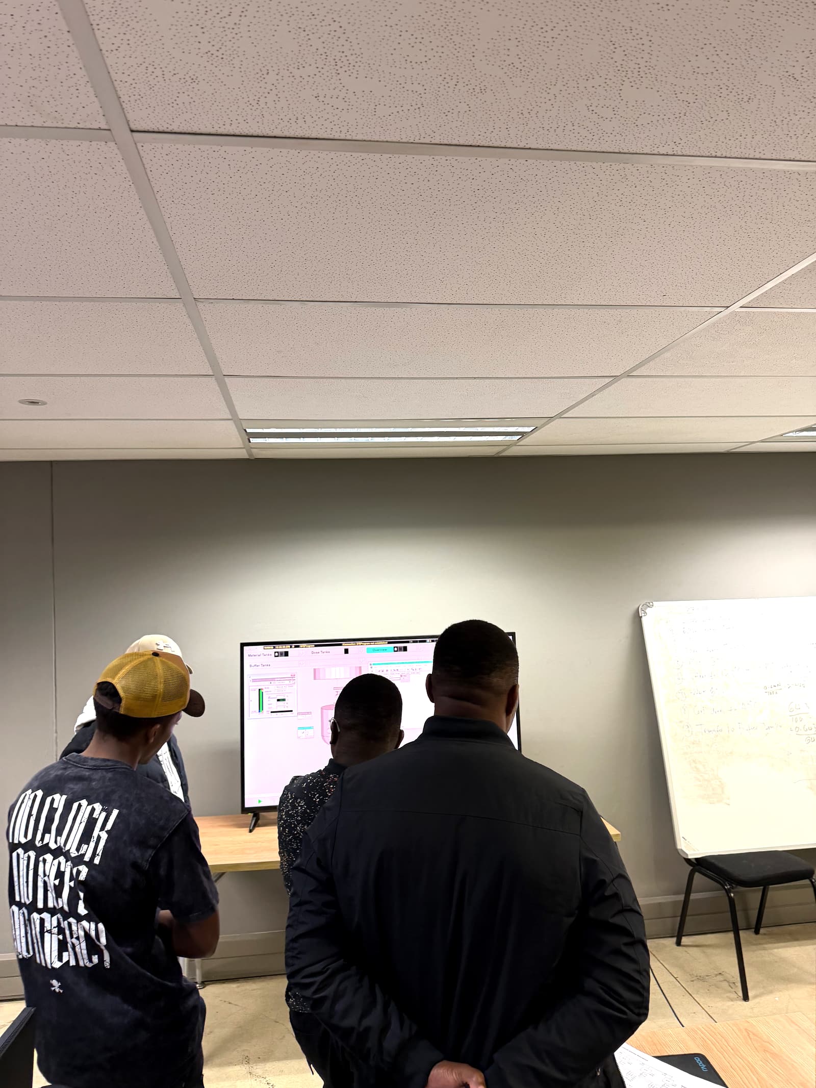 Learners running their control logic against the plant simulation on a live SCADA screen